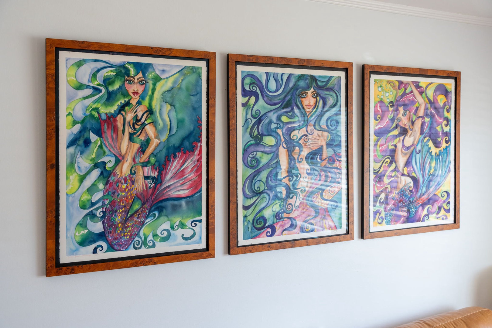 Vibrant mermaid artwork brings whimsical charm to your walls, creating an enchanting atmosphere in your personal retreat.