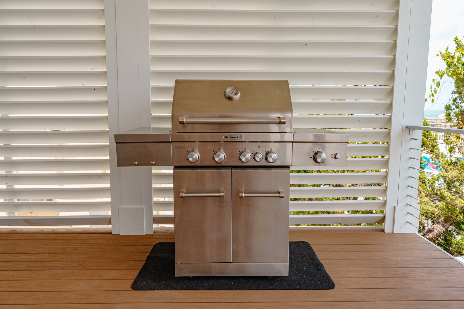 Fire up your vacation memories with this premium outdoor grill, perfectly positioned on your private deck for memorable BBQ gatherings.