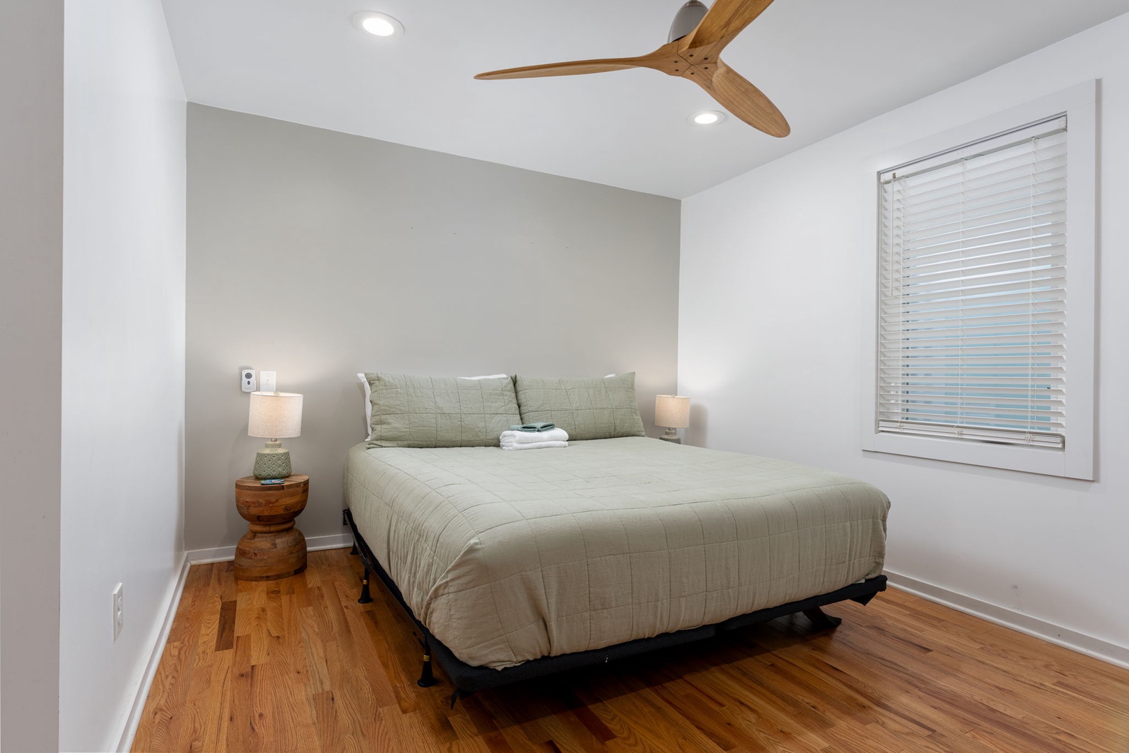 Drift off in your serene bedroom, where soft linens and warm wood floors create the perfect retreat after exploring.