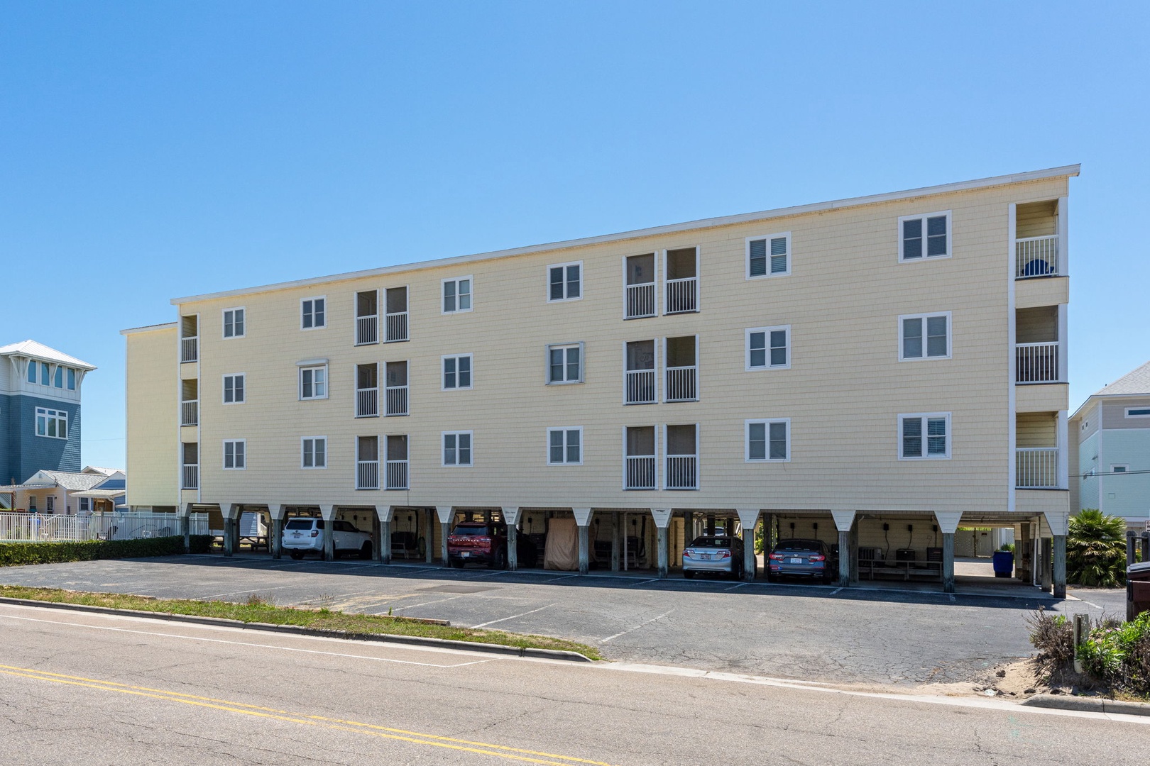 Coastal multi-family property with covered parking and ocean-side access in a sunny beachfront neighborhood.