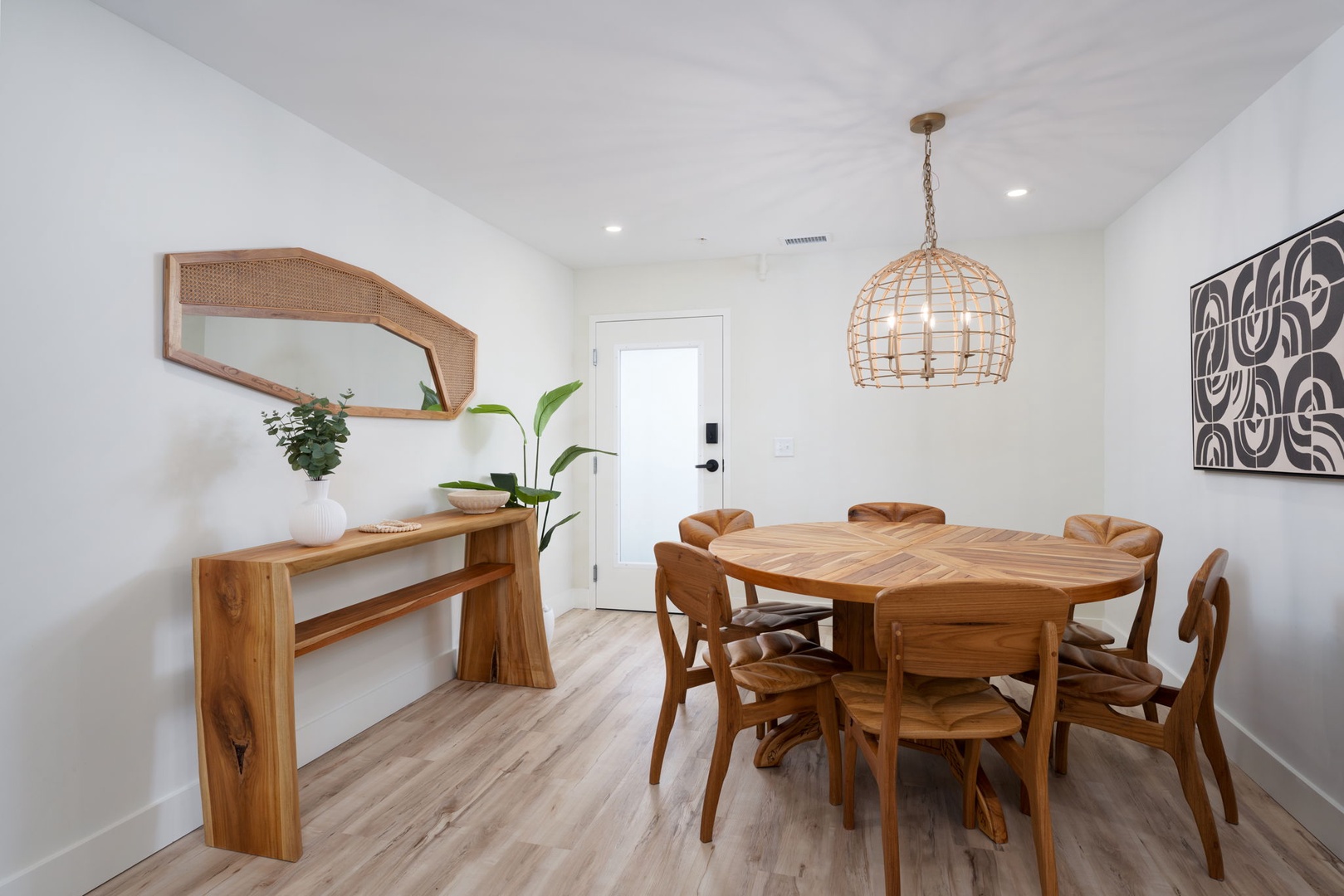 Gather around this warm wooden dining table where memorable meals and conversations await your group.