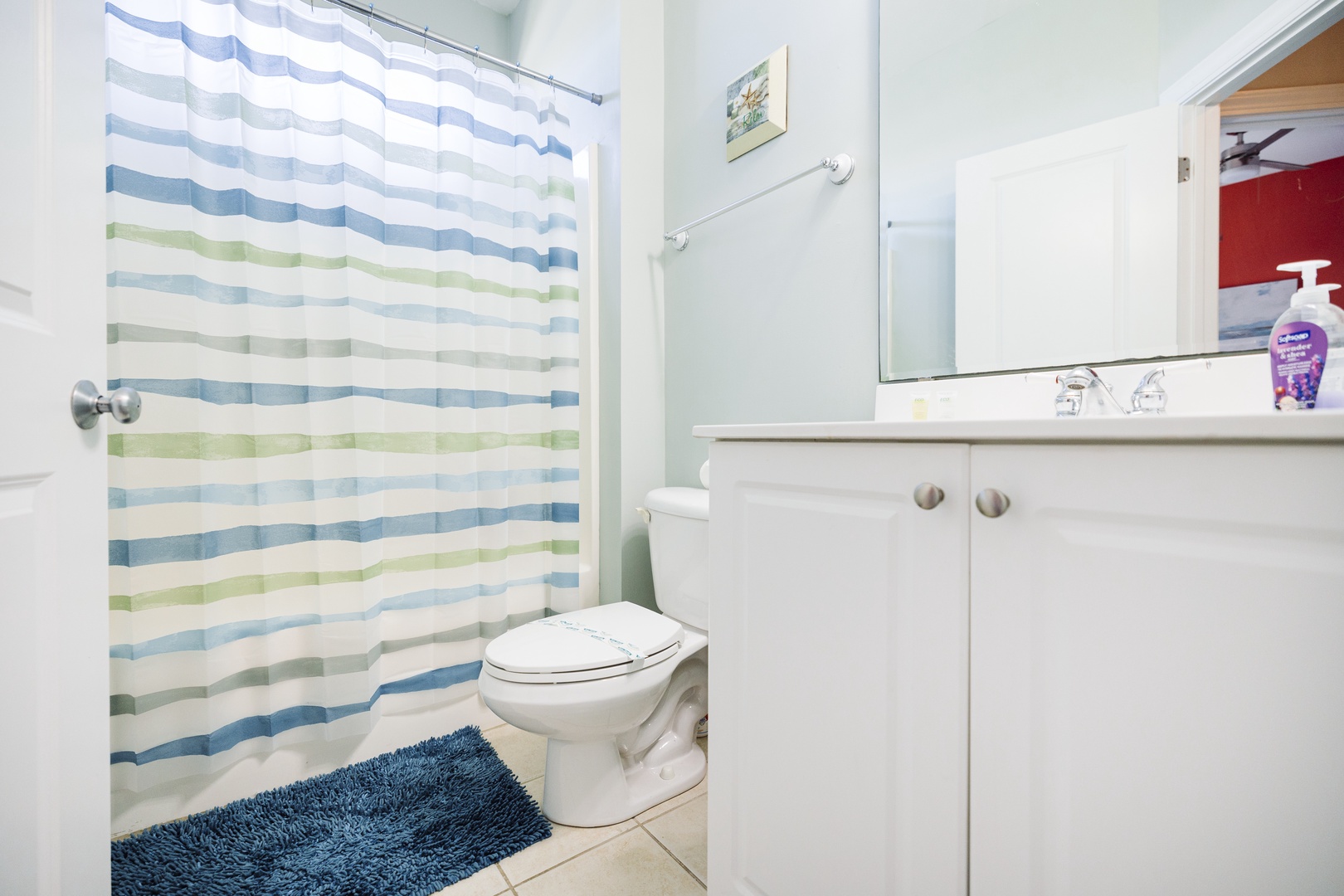 Step into your bright, clean bathroom featuring a refreshing shower and modern vanity where you'll start each morning feeling energized.