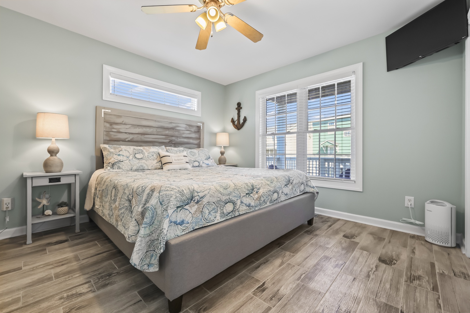 Drift off to sleep in your serene coastal retreat, where calming sea-inspired tones and nautical touches create your perfect beachside sanctuary with a comfy queen bed.