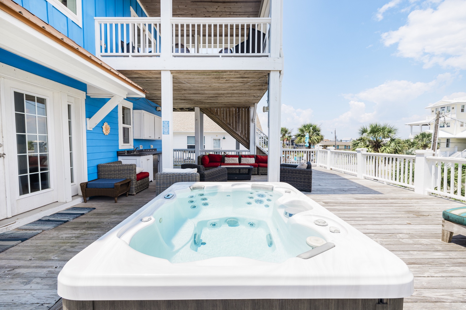 Soak your cares away in your private hot tub while enjoying ocean breezes on this expansive deck with comfortable seating.