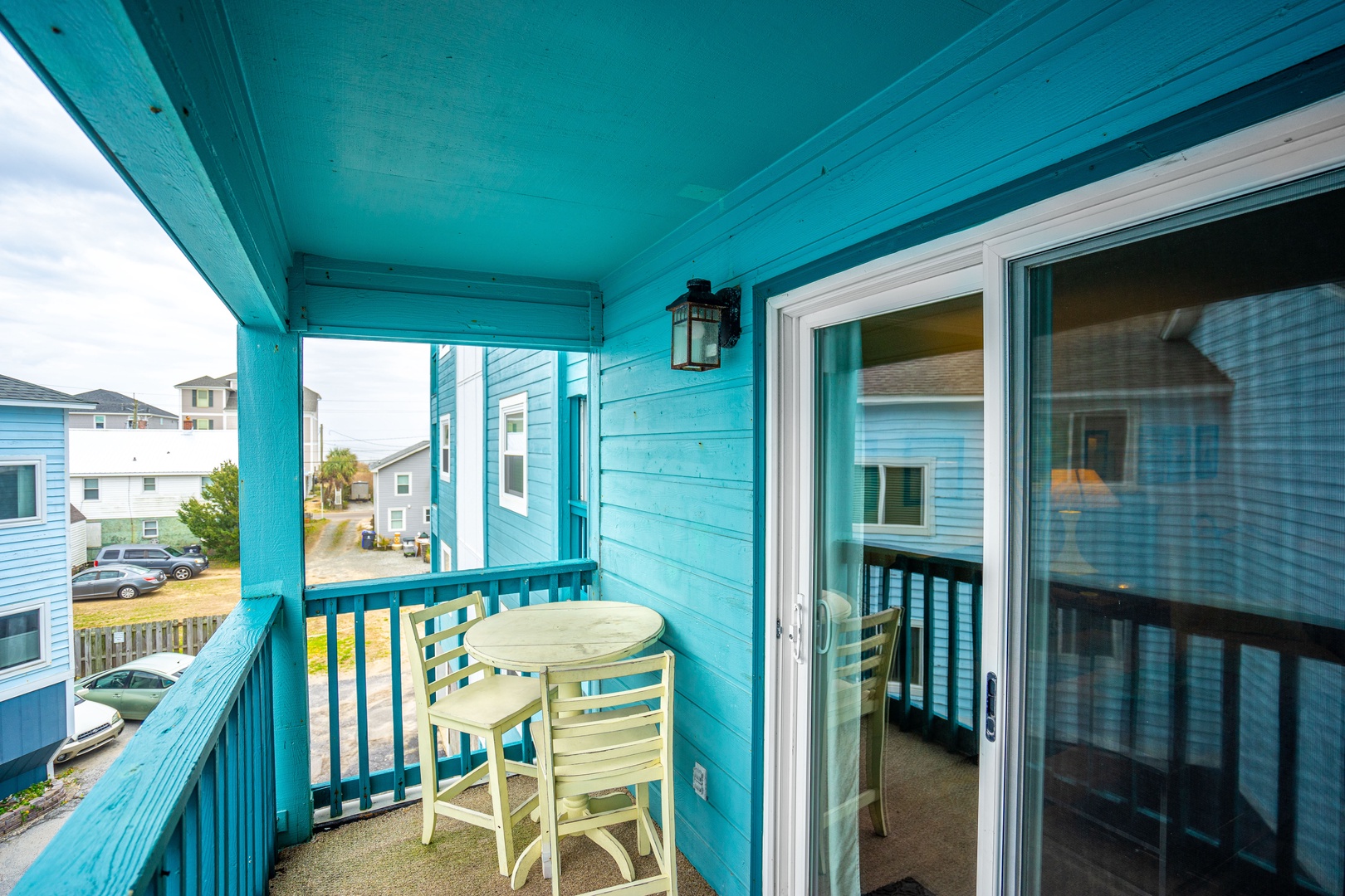 Step onto your private covered balcony with bistro table - perfect for morning coffee while watching the neighborhood come alive.