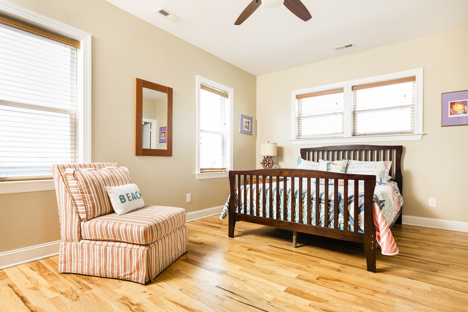 Your child will sleep peacefully in this bright, airy nursery with comfortable seating for bedtime stories and natural light.
