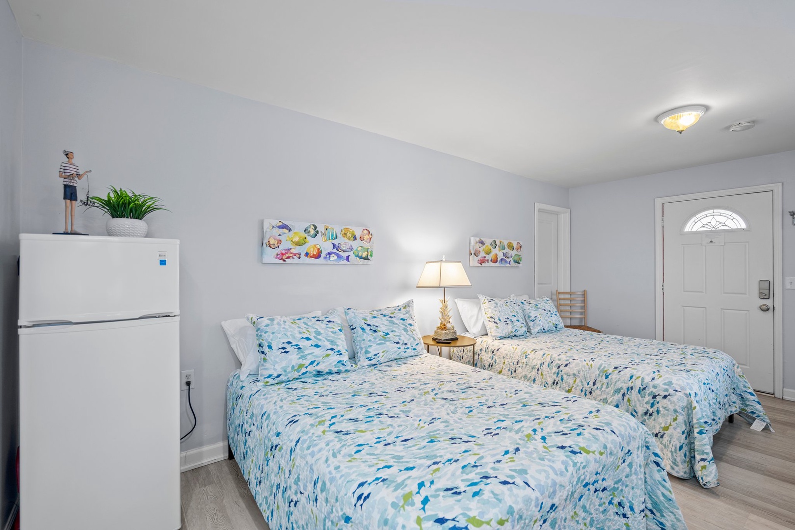 Rest peacefully in your bright bedroom with twin beds dressed in soothing blue linens, plus convenient mini-fridge for late-night snacks.