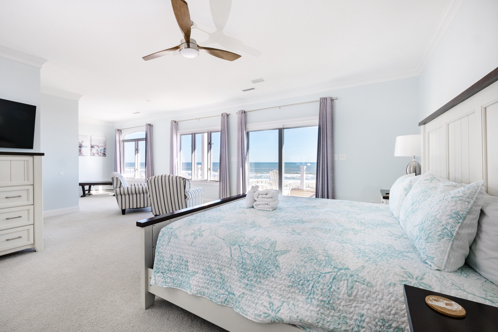 Wake up to stunning ocean views from your spacious bedroom, where gentle sea breezes and coastal comfort create the perfect retreat.