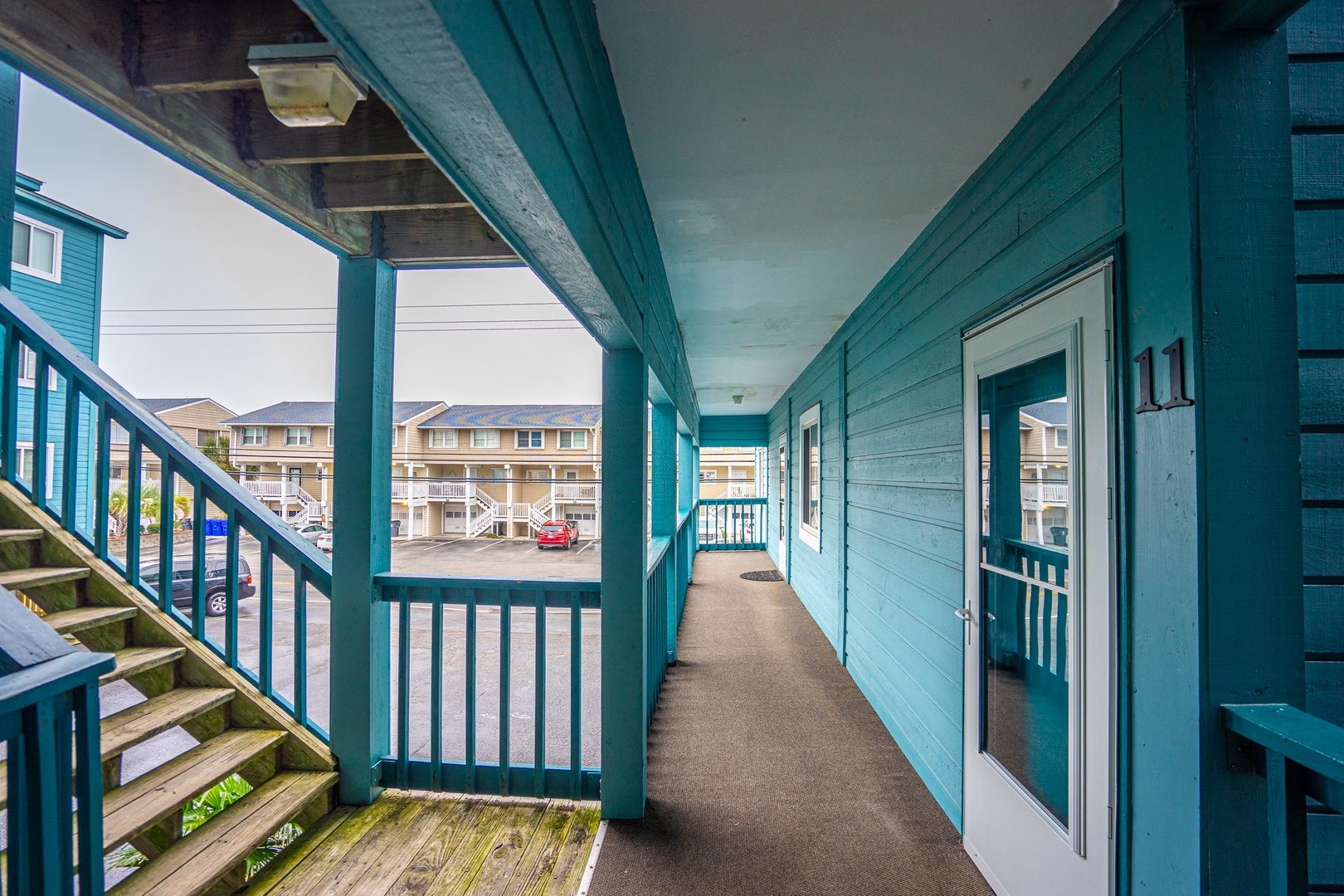 Walk along your charming turquoise balcony overlooking the coastal community below.