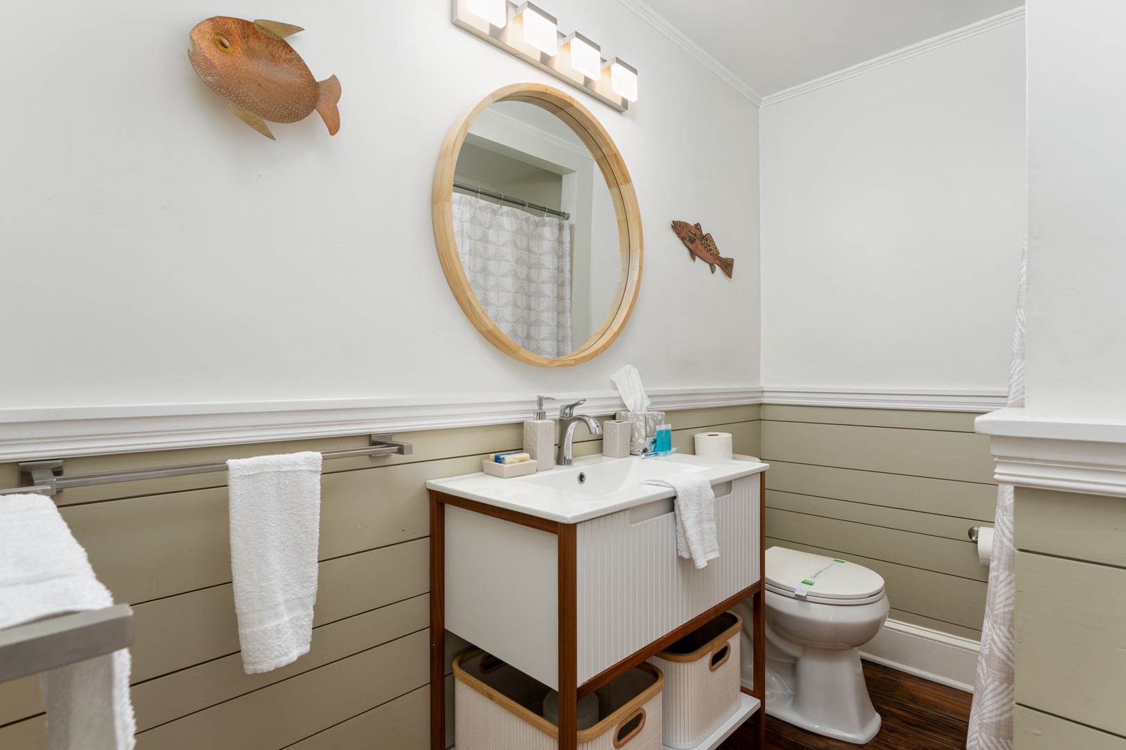 Refresh in your charming coastal bathroom with nautical touches and modern amenities for a perfect seaside getaway.