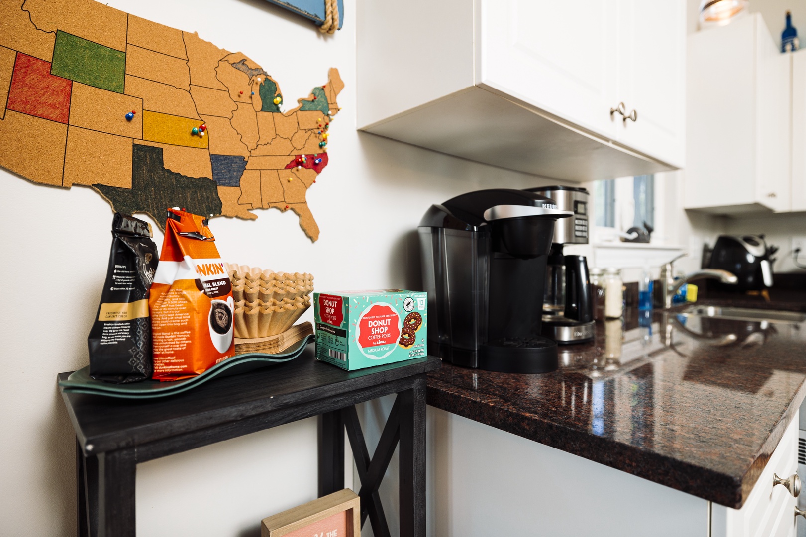 Start your morning right with freshly brewed coffee from your well-equipped station, complete with premium pods and travel-inspired decor.