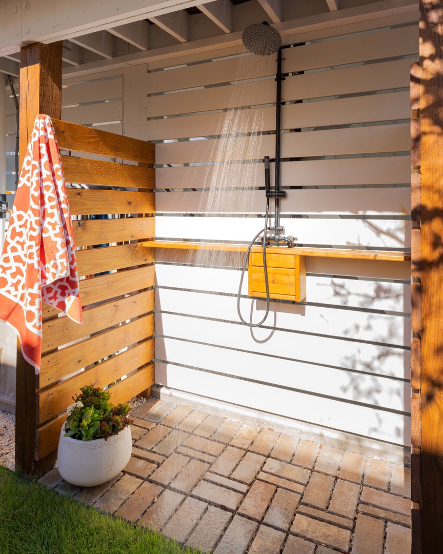 Rinse off the salt and sun in your private outdoor shower, surrounded by warm wood and natural light.