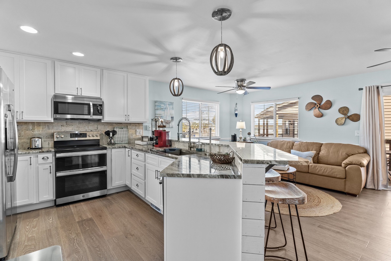 Cook memorable meals in your fully equipped kitchen with granite counters and modern appliances, then unwind in the cozy living area.