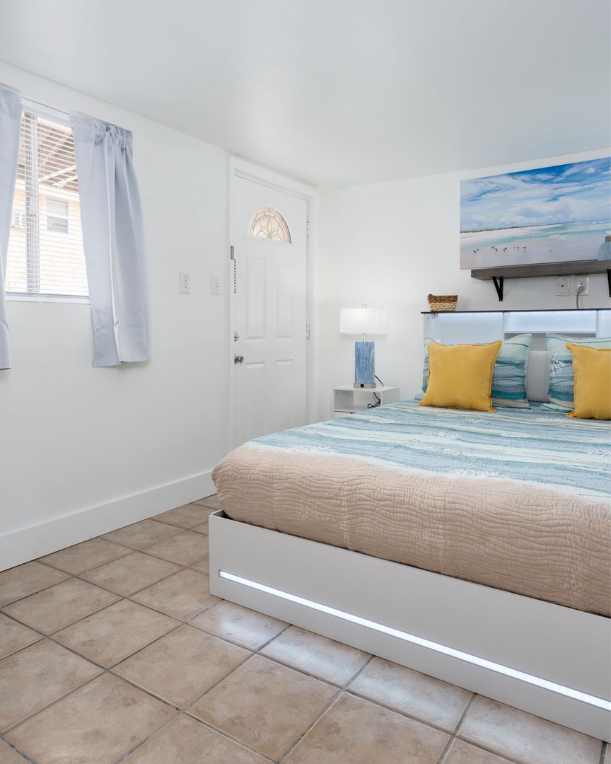 Drift off to sleep in this coastal-themed bedroom, where ocean blues and sunny yellows create your perfect seaside sanctuary.