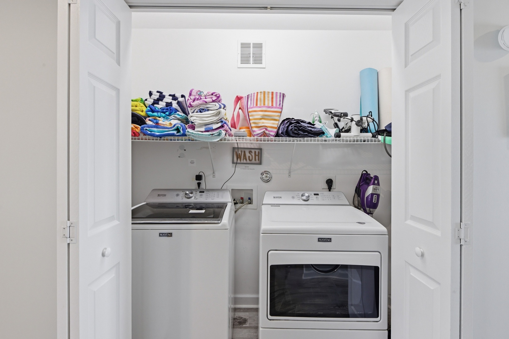 Keep your favorite beach towels and vacation outfits fresh and ready—this dedicated laundry space with washer and dryer makes packing light effortless.