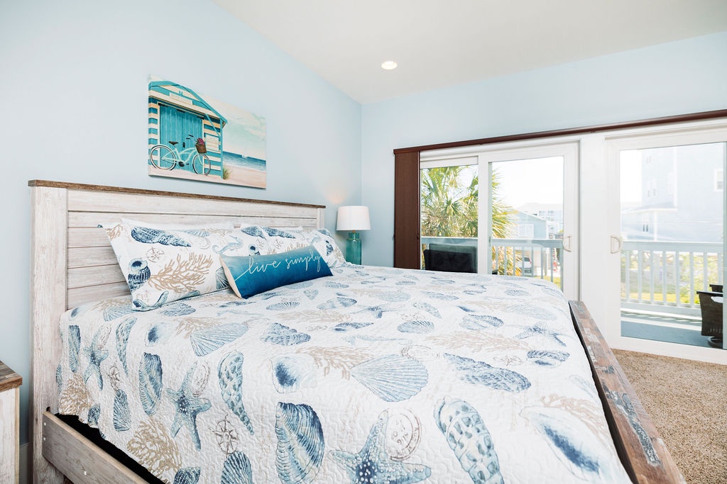 Wake up in coastal comfort with ocean-inspired bedding and your private balcony overlooking palm trees.