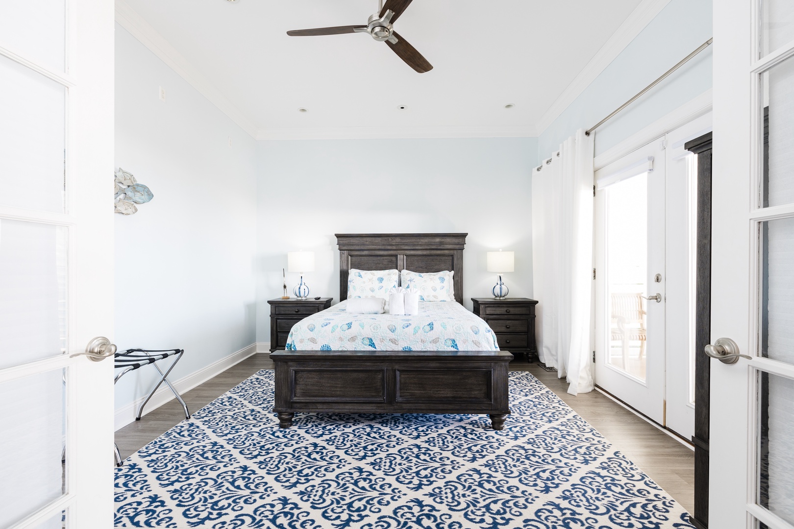 Drift off in your serene coastal bedroom, where nautical blues and crisp whites create the perfect seaside sanctuary for restful nights.