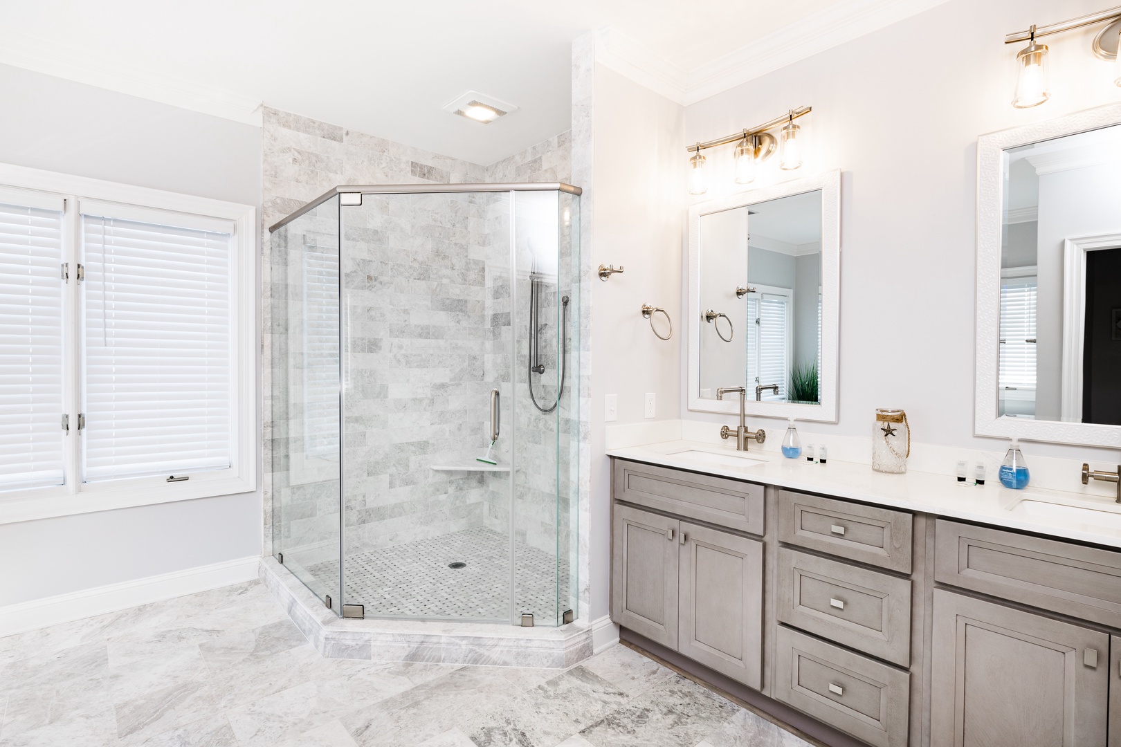 Step into your luxurious master bathroom featuring a spacious glass shower and elegant marble finishes for ultimate relaxation.