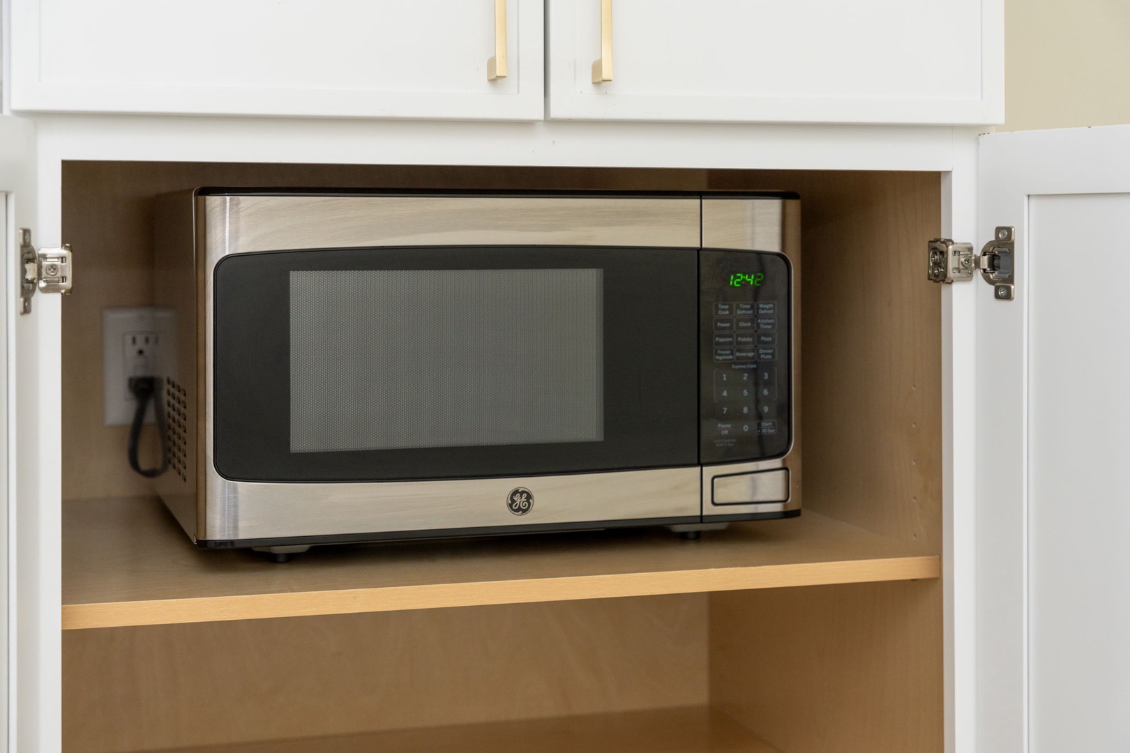 Your built-in microwave makes quick meals effortless, tucked perfectly into custom cabinetry for a clean, modern kitchen experience.