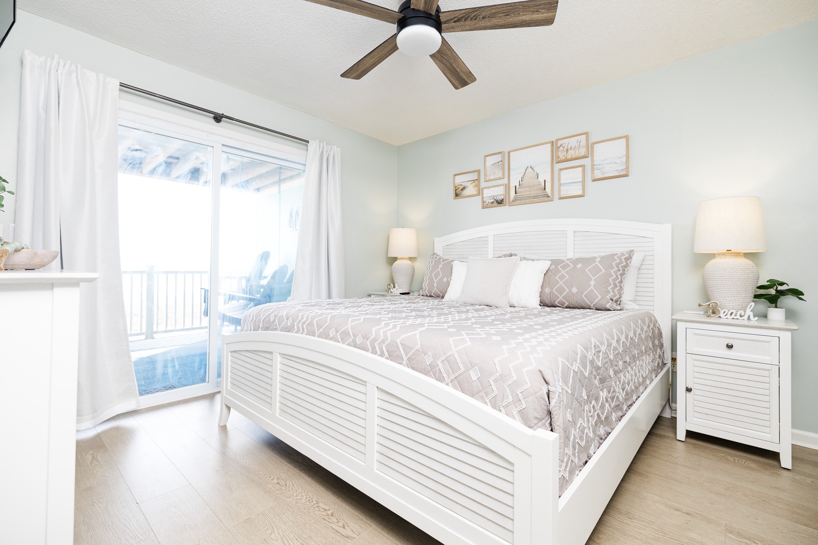 Your peaceful retreat with coastal charm, where soft morning light filters through sheer curtains onto crisp linens and soothing neutral tones.