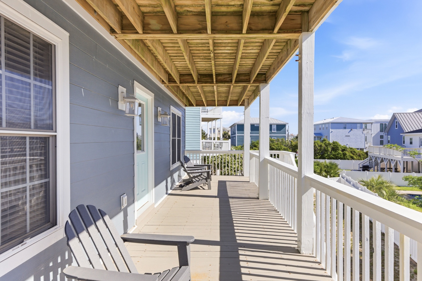 Enjoy your morning coffee or evening cocktails on your private covered porch, with coastal breezes and neighborhood views creating the perfect spot to unwind.