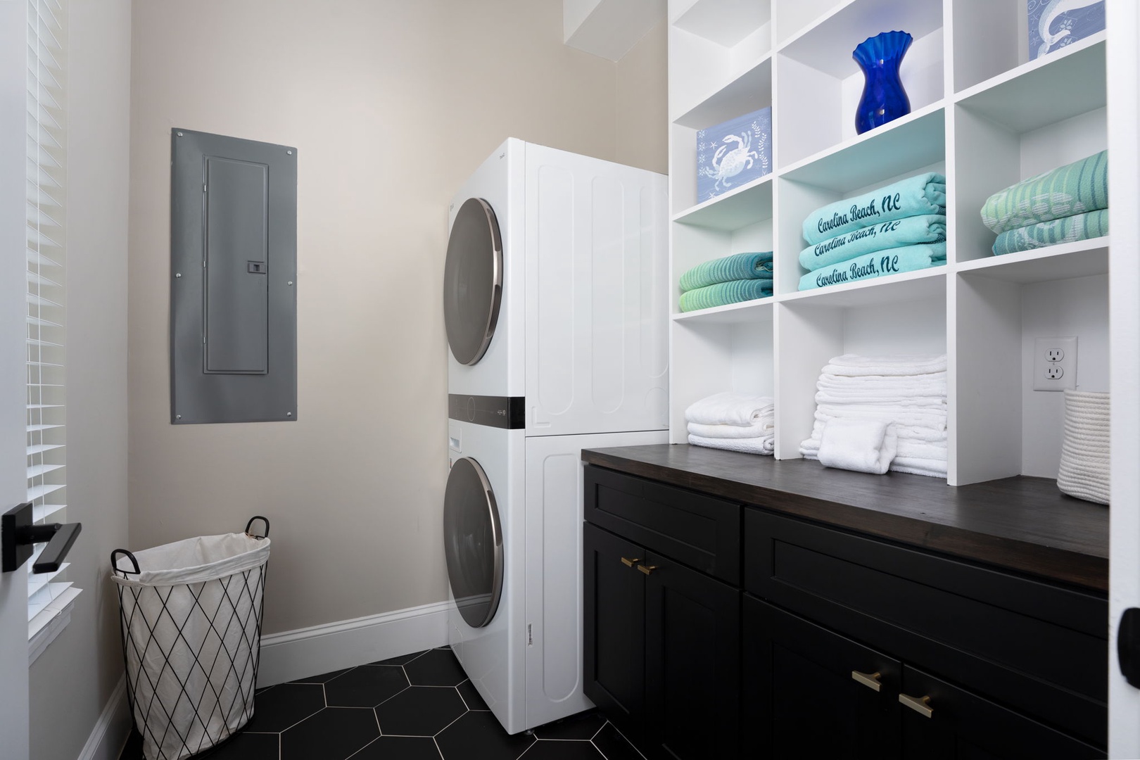 Enjoy your own in-unit laundry room with built-in storage to keep your vacation wardrobe fresh and organized.