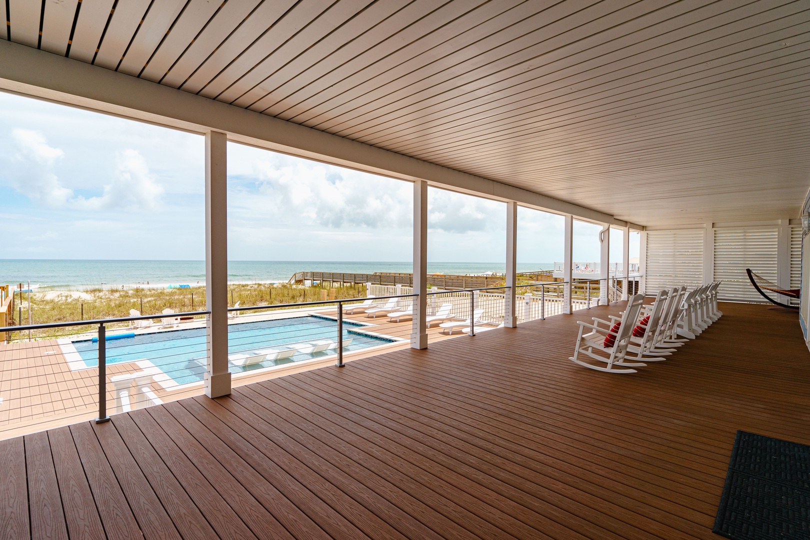 Relax in your private beachfront haven with stunning ocean views and pool access right from your covered terrace.