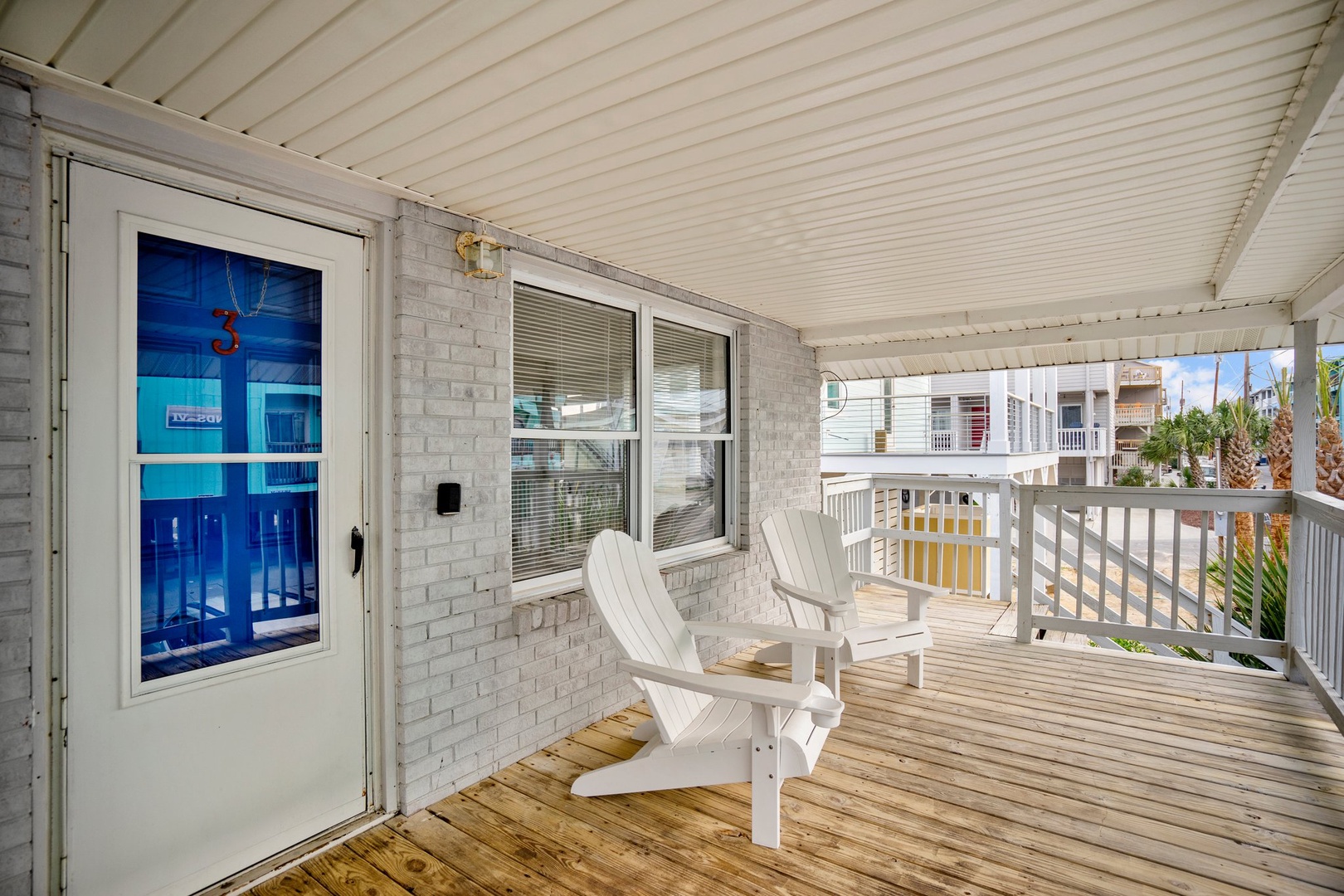 Relax on your private covered balcony with comfortable Adirondack chairs, where tropical breezes and sunshine create the perfect spot for morning coffee.