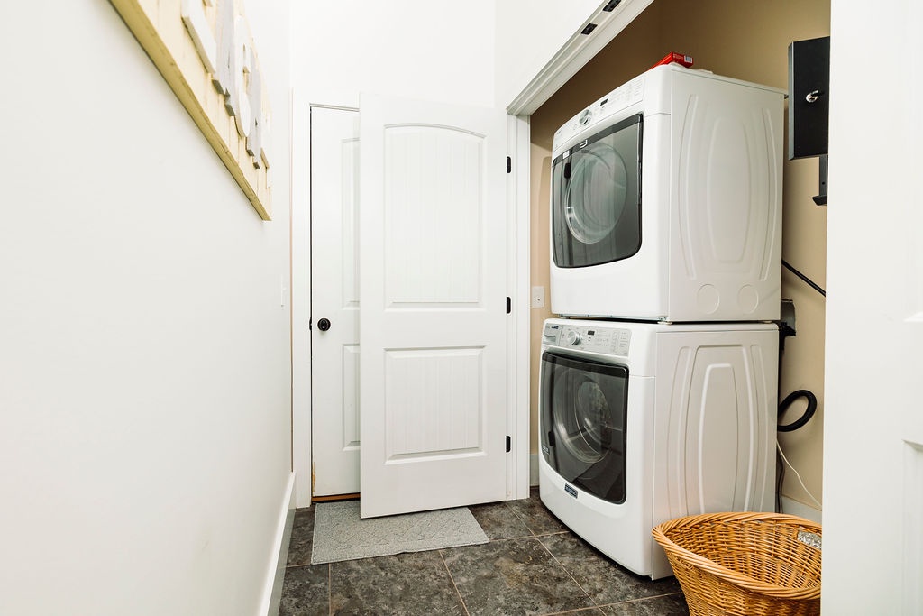 Your dedicated laundry space keeps your vacation wardrobe fresh with a full-size washer and dryer stacked conveniently in this clean, well-lit area.