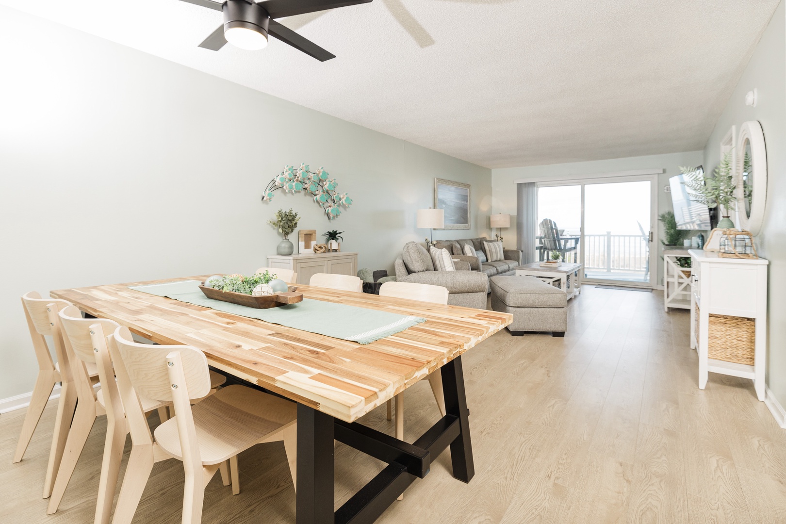 Your bright open-plan living space flows seamlessly from dining to relaxation, with ocean breezes from your private balcony.