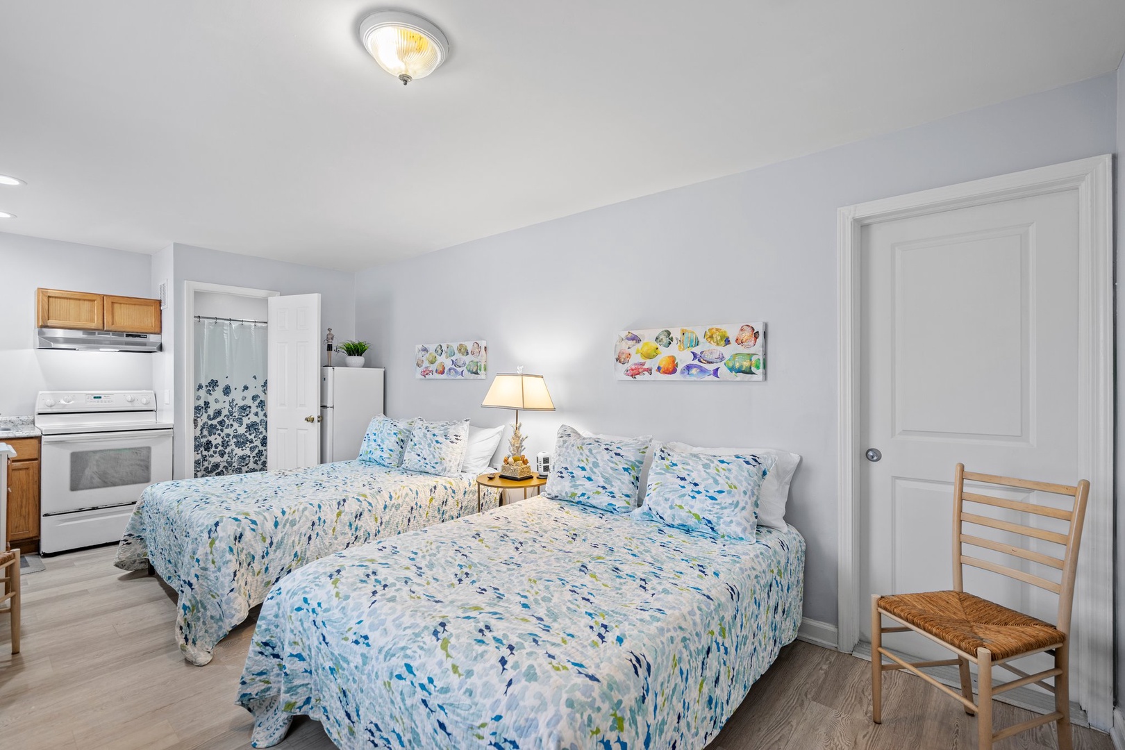 Rest peacefully in your bright, airy bedroom with comfortable twin beds and cheerful blue linens that create a coastal feel.