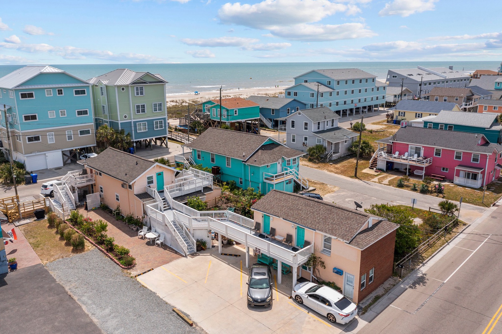 Charming beachside neighborhood featuring colorful coastal homes just steps from pristine sandy shores and sparkling ocean waters.