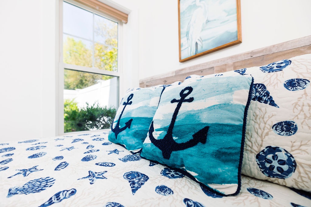 Drift off to dreams of the sea in your coastal-themed bedroom, where ocean-inspired bedding and nautical touches create a serene seaside retreat.