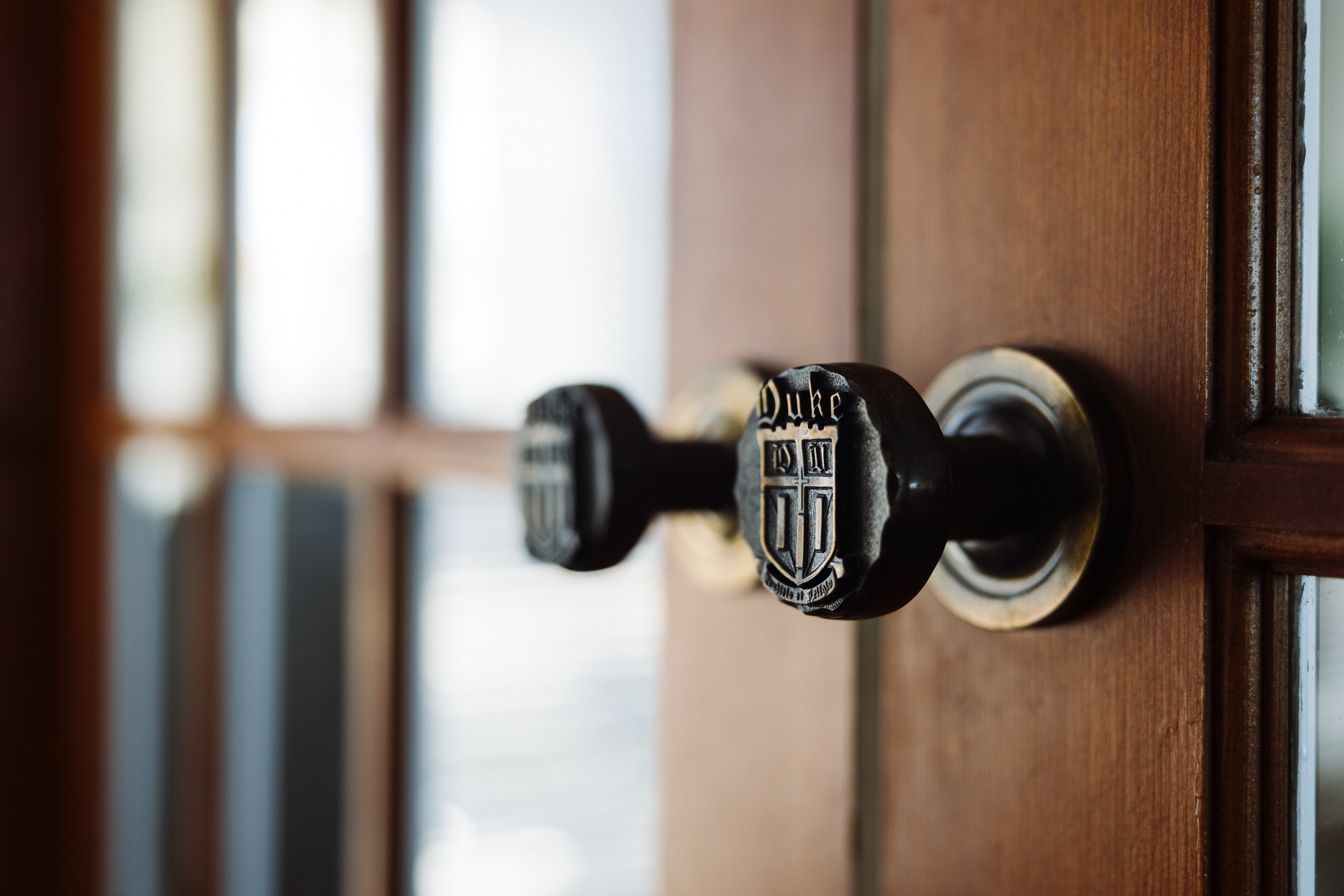 Step through your private entrance with elegant Duke-themed door handle into your cozy retreat.