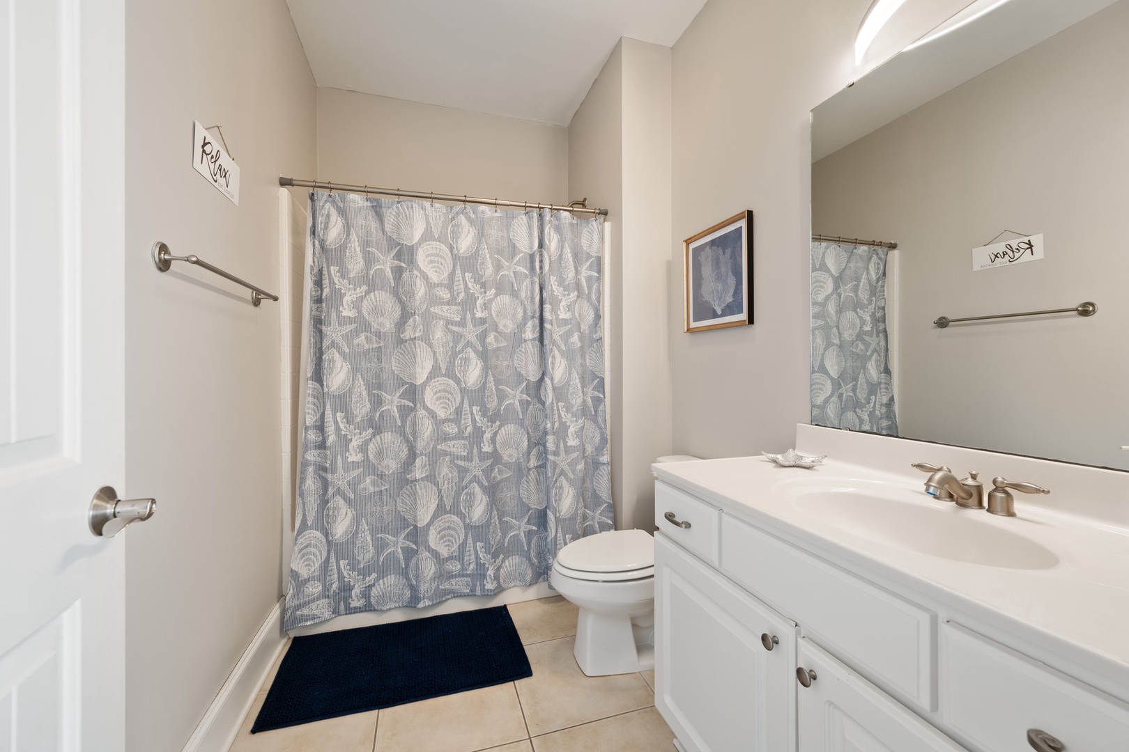 Fresh, clean bathroom with modern amenities and thoughtful touches to make your stay comfortable and refreshing.