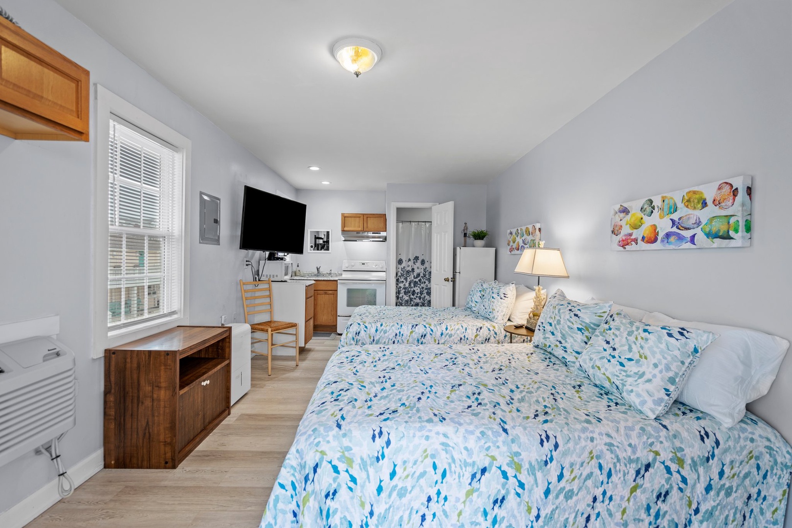 Relax in your bright studio with dual beds, full kitchen, and charming coastal décor creating a peaceful retreat.