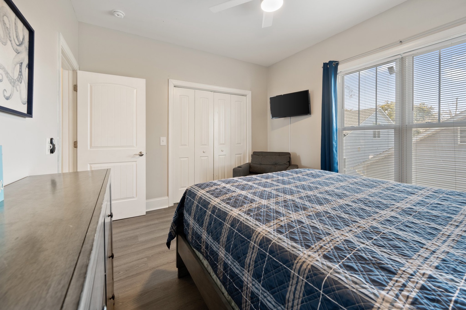 Sink into your comfortable bed with crisp linens, enjoy watching TV, and appreciate the abundant natural light streaming through large windows.
