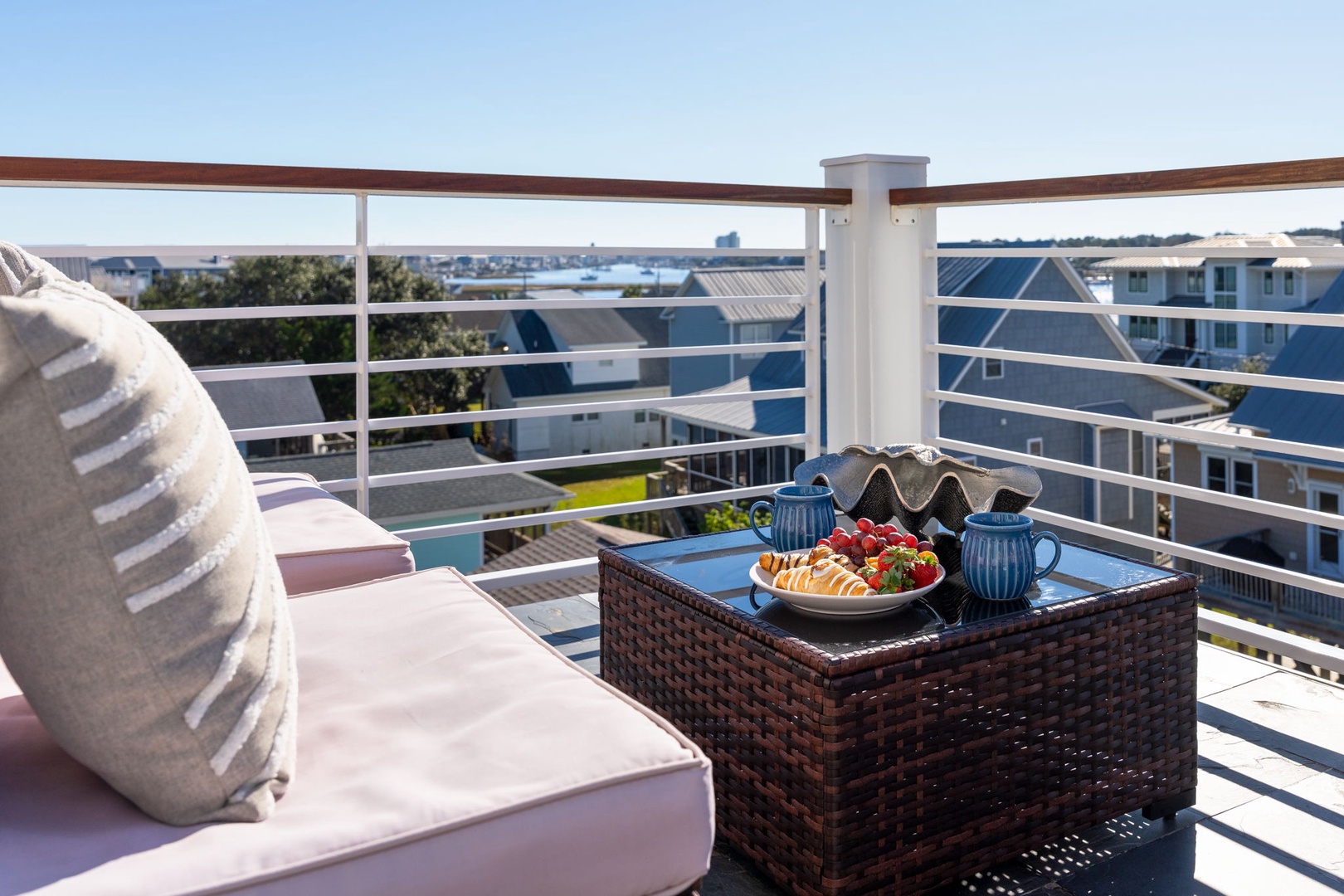 Savor your morning coffee on your private balcony, where plush seating and panoramic views create the perfect spot to start each day.