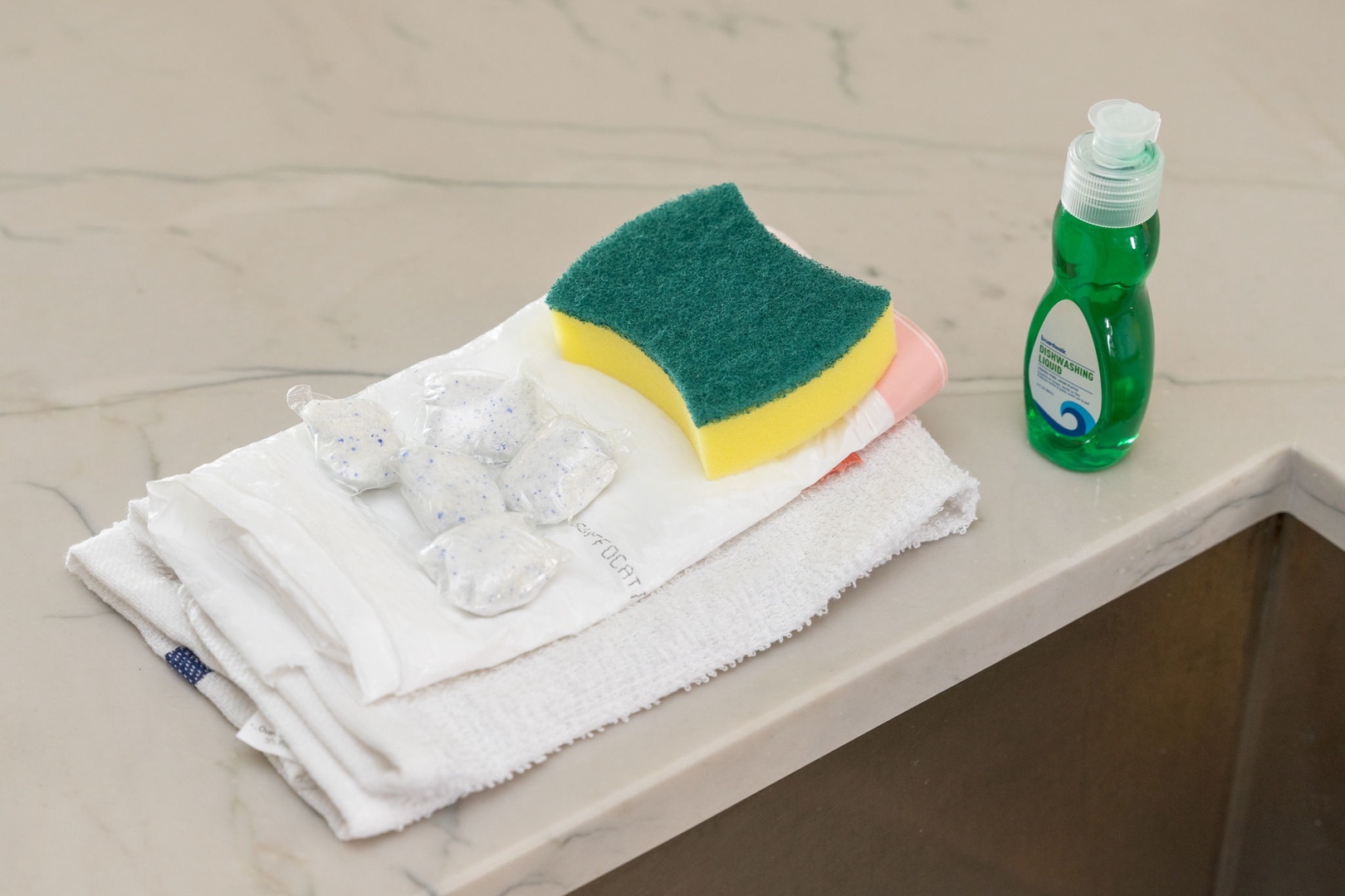 Your kitchen stay includes thoughtful cleaning supplies - fresh towels, sponges, and eco-friendly detergent to keep your space spotless during your visit.