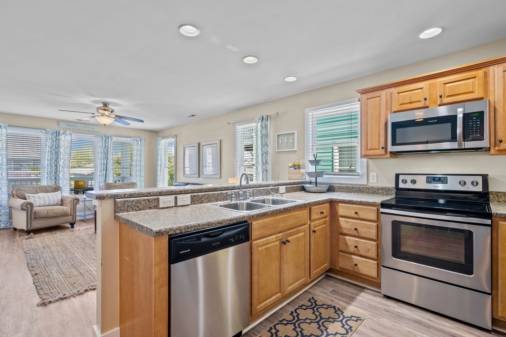 Your fully equipped kitchen flows seamlessly into the bright living area, perfect for preparing meals while staying connected with family and friends.