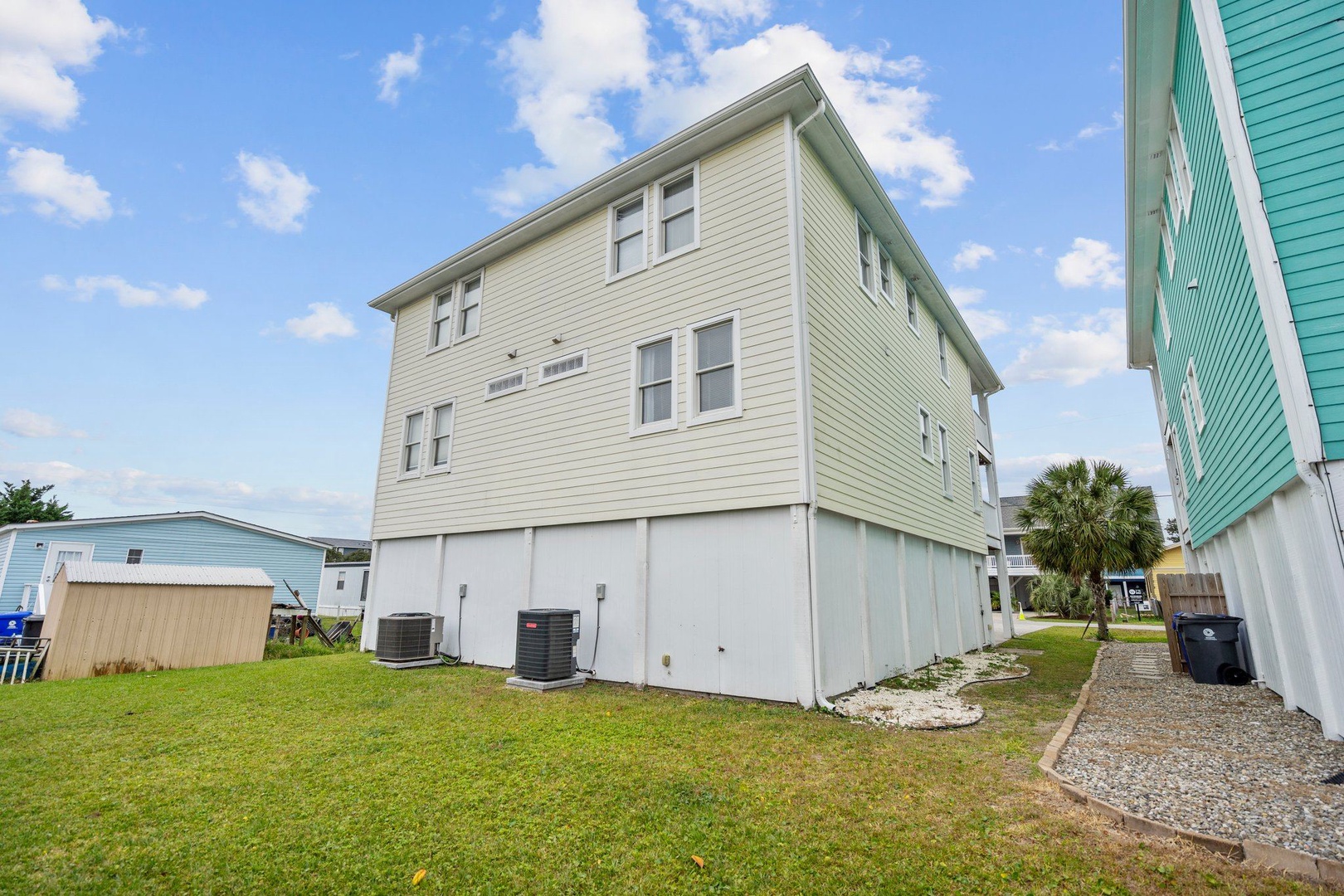 Coastal rental home featuring modern siding and elevated design typical of beach communities.