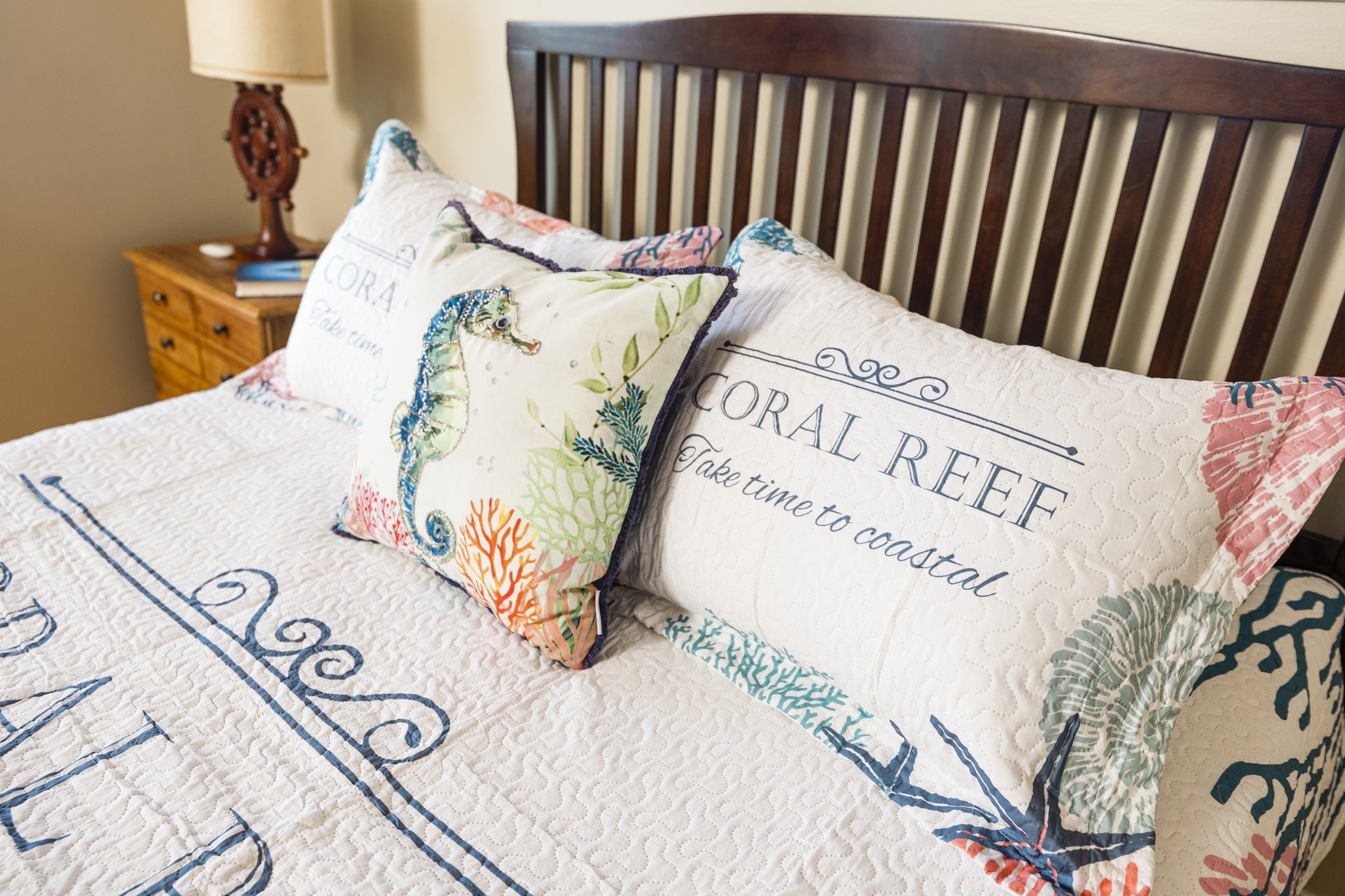 Drift into coastal dreams on your comfortable bed, surrounded by charming ocean-themed pillows and nautical touches that bring seaside serenity indoors.