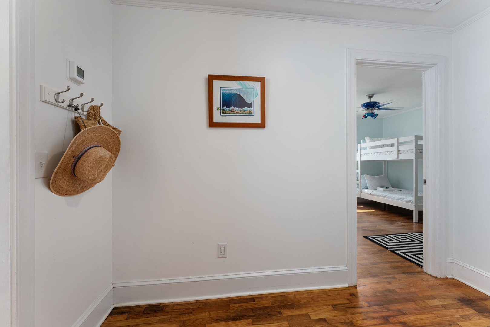 Hang your sun hat on the convenient hooks as you settle into this bright, welcoming space with gleaming hardwood floors.
