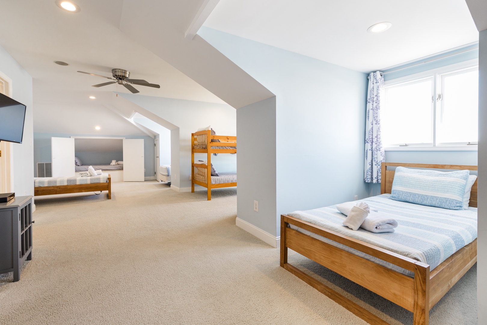 Your spacious attic bedroom features comfortable beds and bunk beds, perfect for families or groups seeking restful nights together.