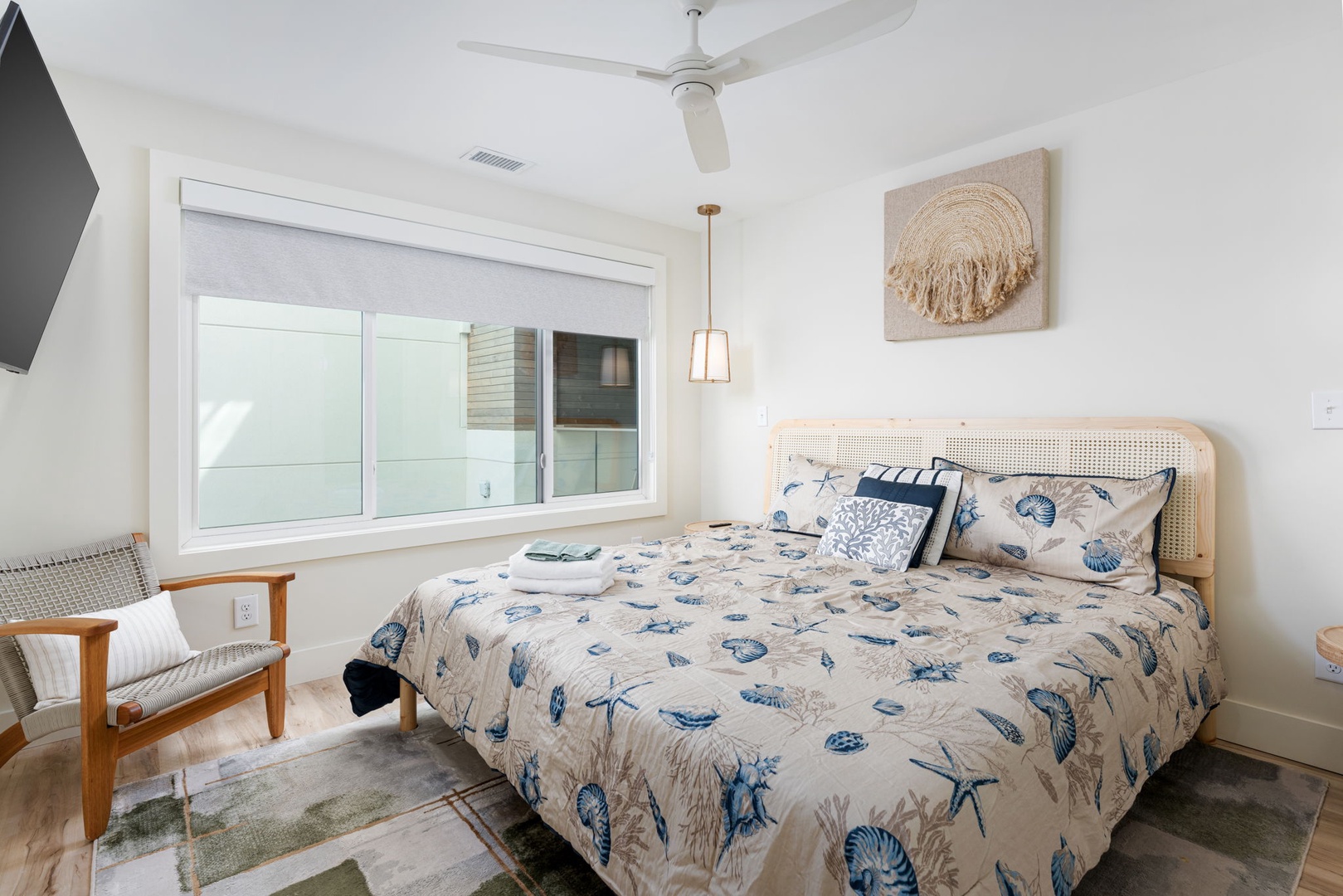 Your coastal-themed bedroom features ocean-inspired linens and natural textures, creating a serene retreat where you'll drift off to seaside dreams.