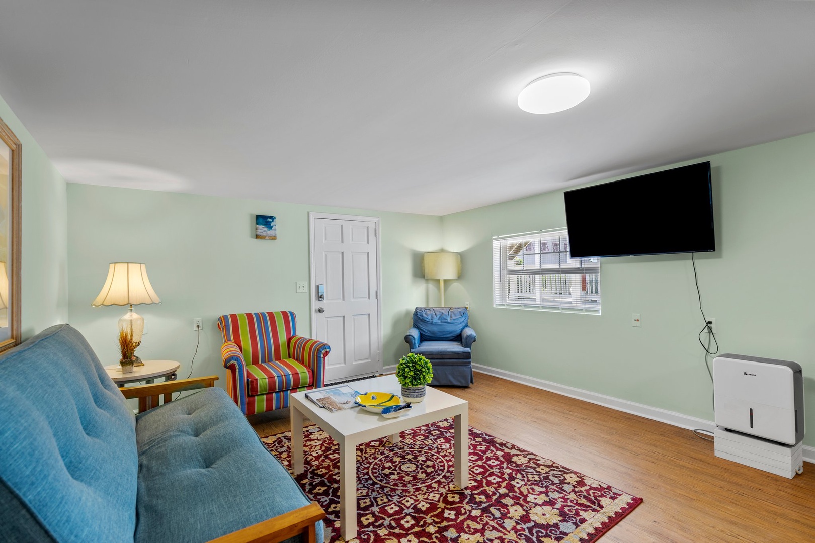Unwind in your colorful living space with comfortable seating, entertainment, and cheerful décor that makes you feel right at home.
