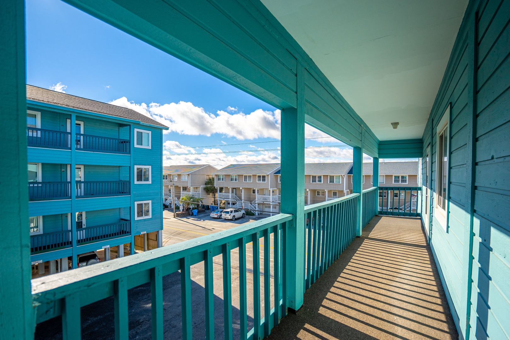 Step out onto your private covered balcony and breathe in the fresh coastal air while enjoying peaceful views of the charming neighborhood.
