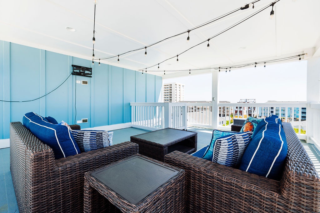 Unwind on your private terrace with comfortable seating and twinkling lights overhead, while enjoying panoramic city views.
