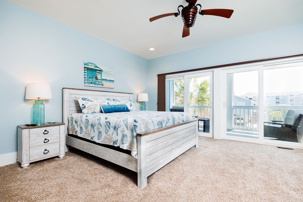 Your coastal bedroom retreat features ocean-inspired decor with soft blues and whites. Step onto your private balcony to enjoy refreshing breezes.