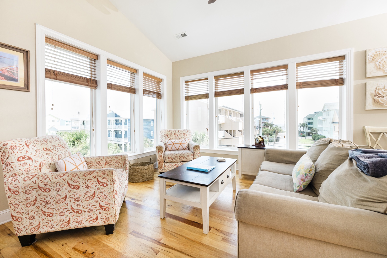 Sink into plush seating while enjoying stunning panoramic views through floor-to-ceiling windows in your bright, airy living space.